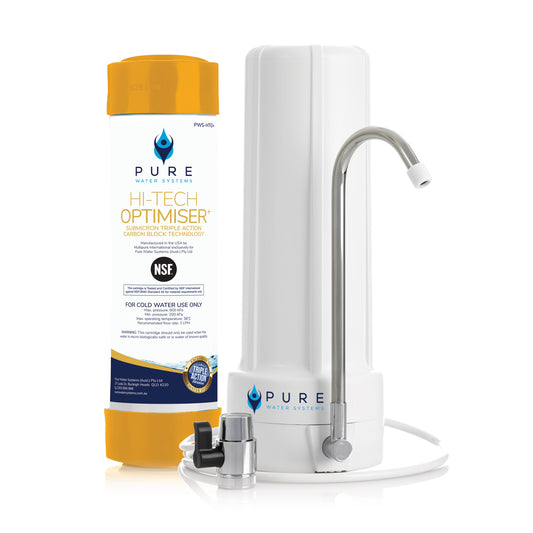 White slimline bench top water filter with chrome curved faucet and black valve attachment.